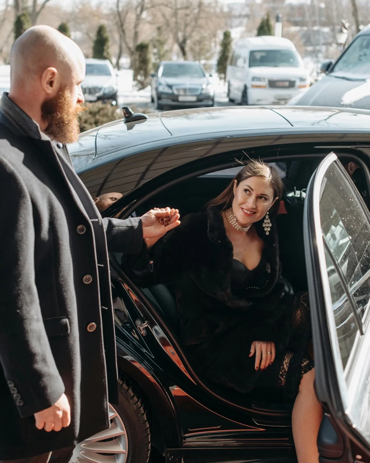 KL Executive chauffeur opening door for a client